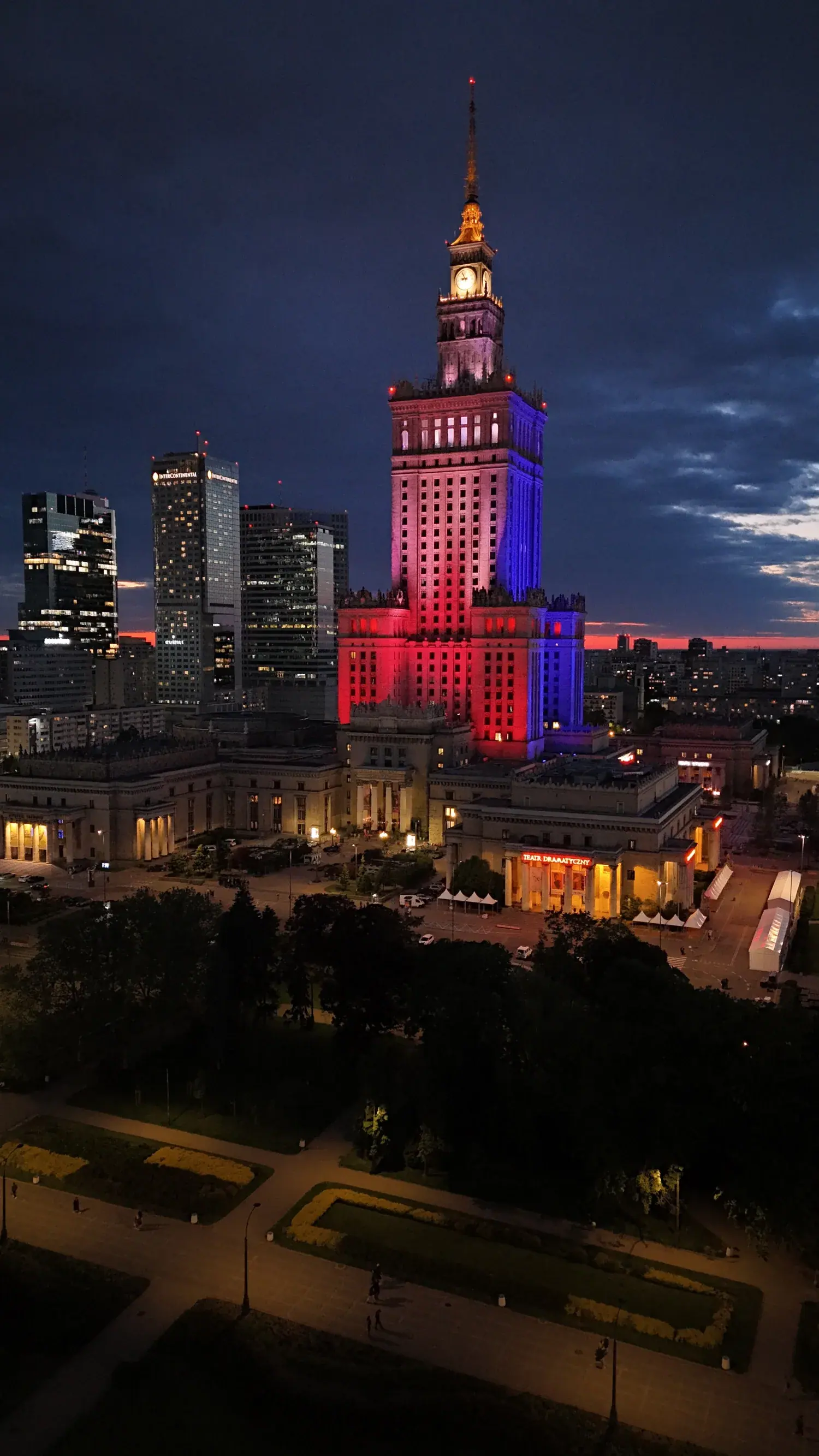 Palace of Culture lit in patriotic red and white at night