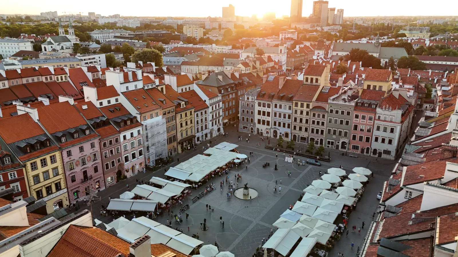 Old Town Market Square at sunset with sun flares and pavilions