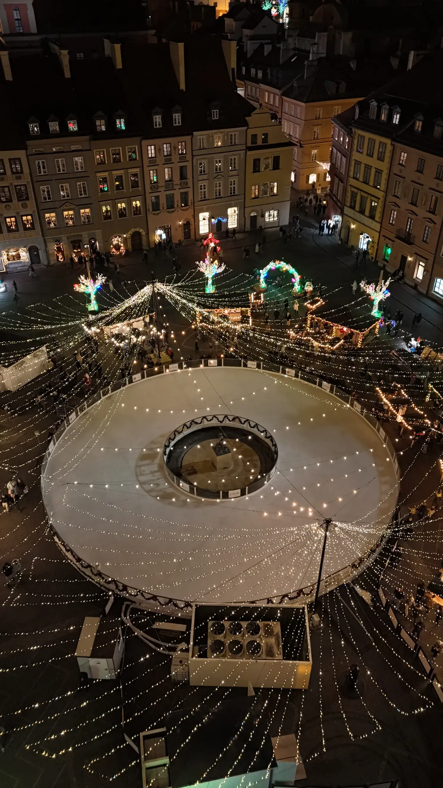 Christmas market with illuminated tree at night