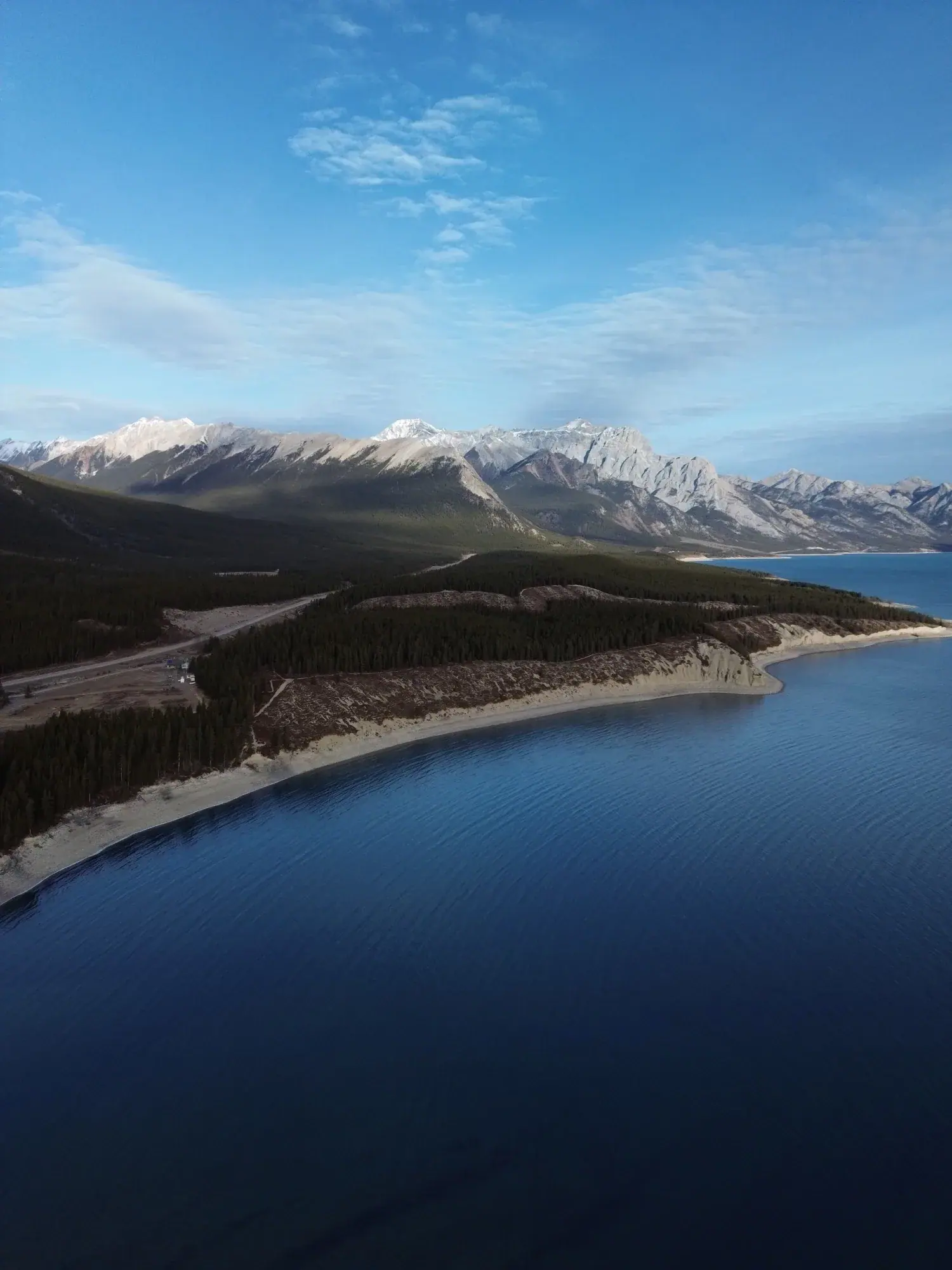 Mountain ridge above a lake — vertical aerial